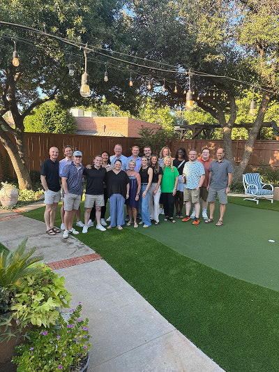 MudMixer employees smiling for a group photo