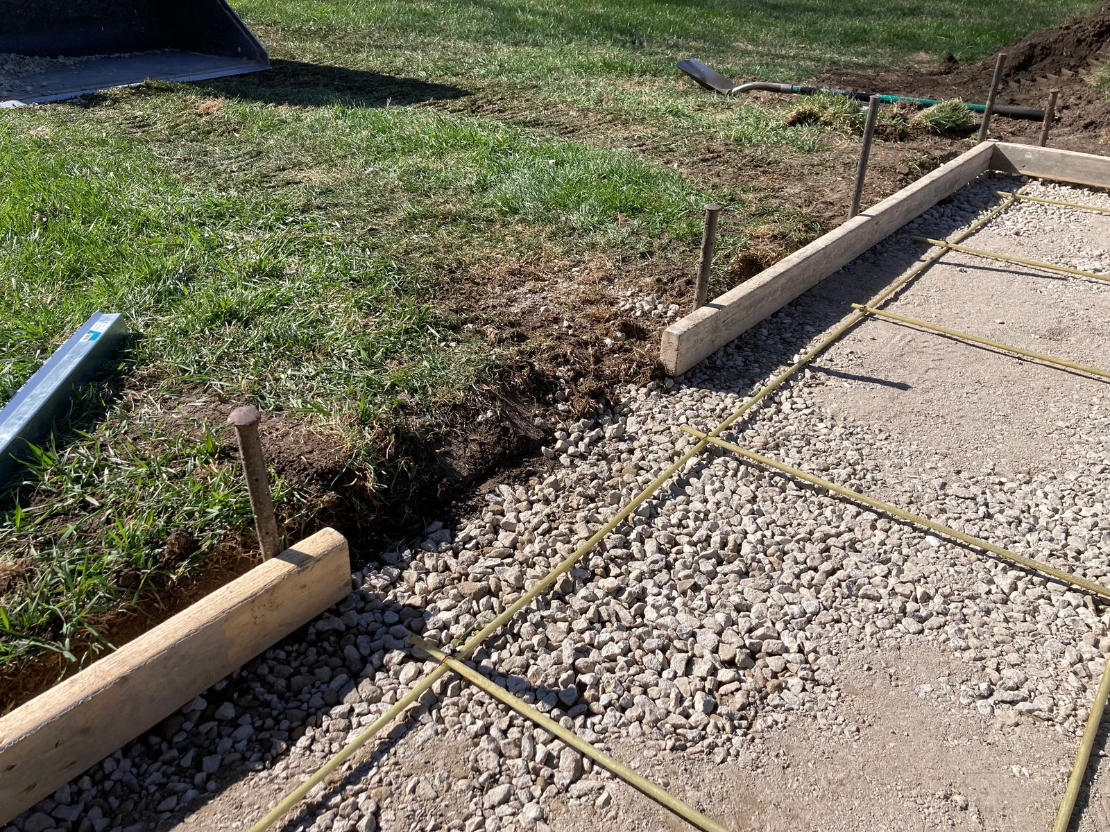 Construction site with gravel and concrete foundation